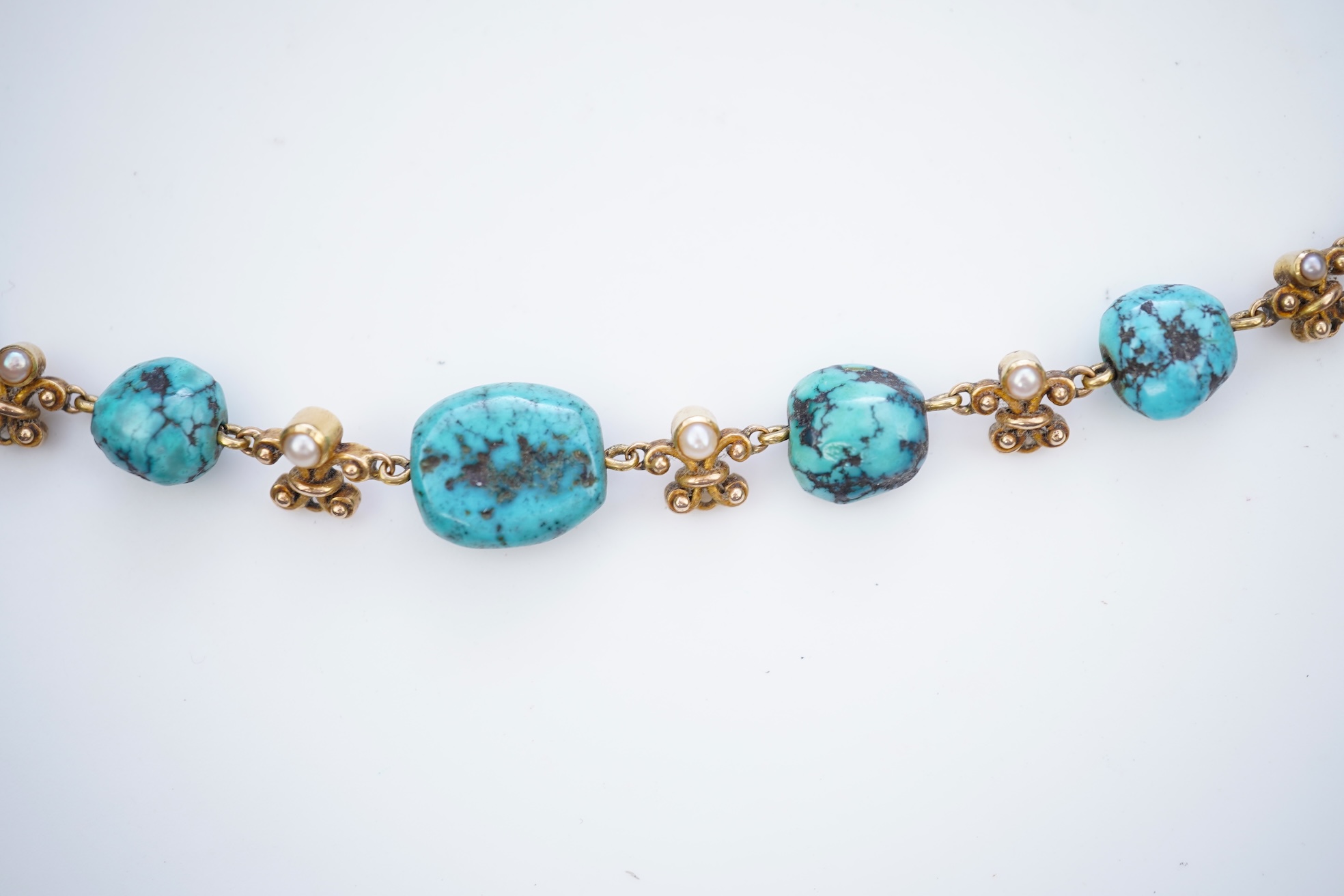 A turquoise and seed pearl necklace, early 20th century